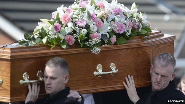 Men carry Jennifer Dornan's coffin at her funeral