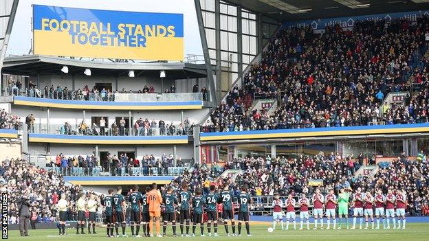 Burnley and Chelsea players displayed their backing for Ukraine before kick-off at Turf Moor