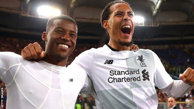 Liverpool players celebrate reaching the Champions League final after beating Roma on aggregate