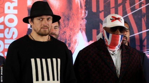 Ukraine's Oleksandr Usyk and Briton Dereck Chisora stand at a news conference announcing their fight