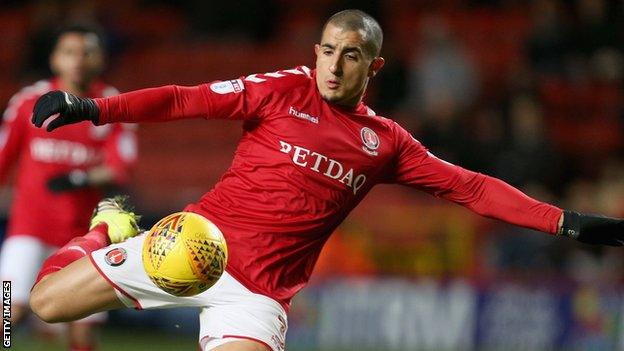 Charlton midfielder Ahmed Kashi prepares to volley a ball