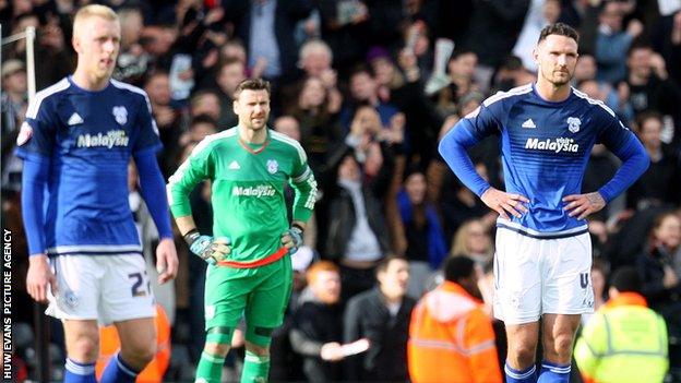 Dejected Cardiff City players following Fulham's late goal