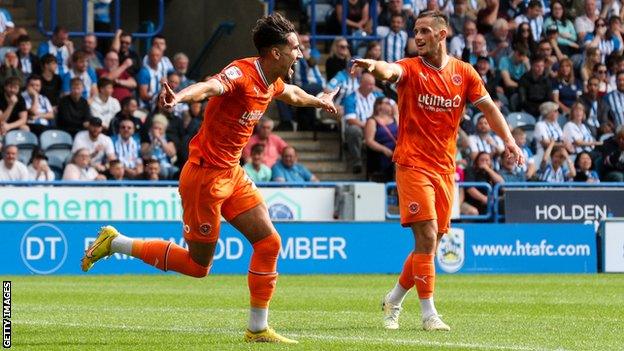 Theo Corbeanu celebrates his goal against Huddersfield