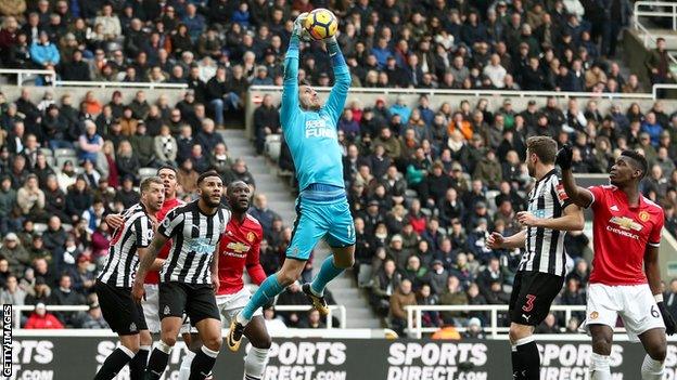 Newcastle goalkeeper Martin Dubravka catches the ball