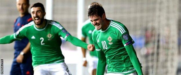 Kyle Lafferty celebrates scoring a crucial last-gasp equaliser against Hungary in September