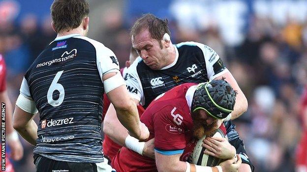 Jake Ball is tackled by Alun Wyn Jones in a Scarlets v Ospreys match