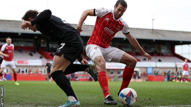 Cheltenham Town defender Matty Blair has announced his retirement from professional football