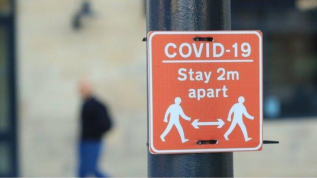 A "stay 2m apart" sign in Manchester