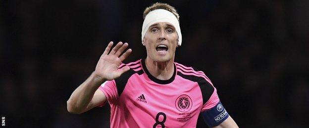 Scotland's captain Darren Fletcher wears a head bandage