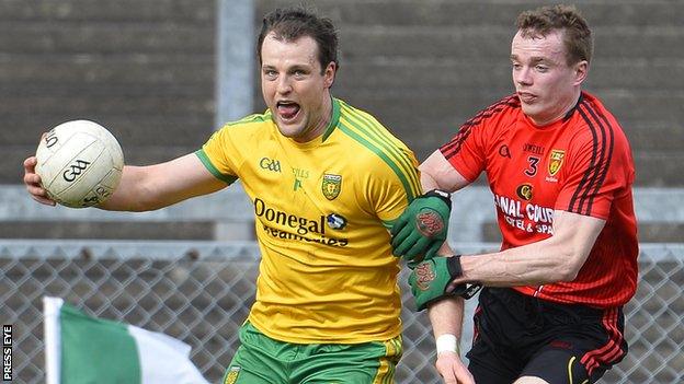 Donegal's Michael Murphy is challenged by Down's Brendan McArdle in the 2014 league encounter