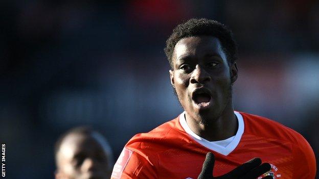 Elijah Adebayo scored the opening goal for Luton Town as they ended QPR's winning run and denied them taking top spot in the Championship