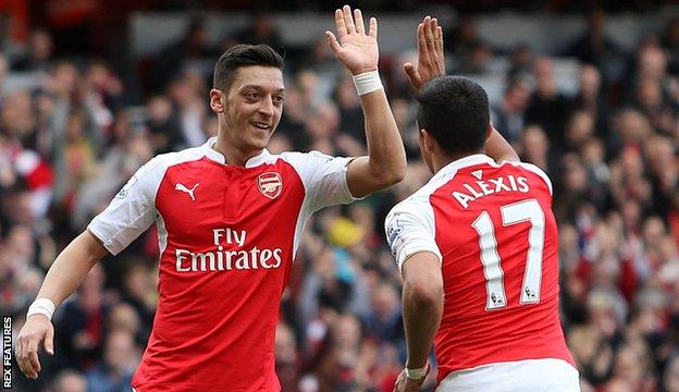 Mesut Ozil (left) with Alexis Sanchez