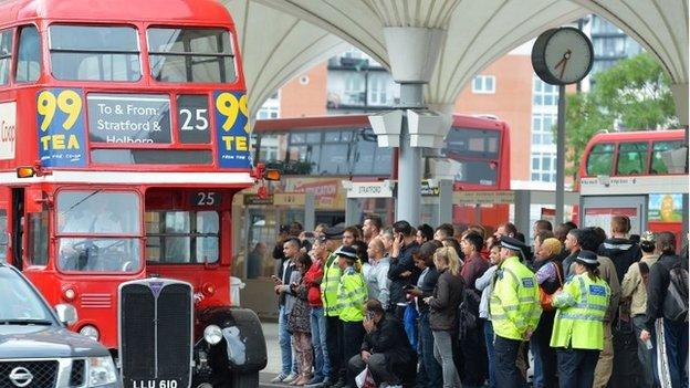 People queue for buses near Stratford station