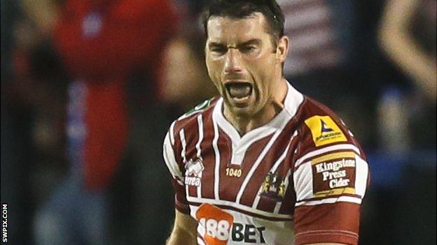 Wigan's Matty smith celebrates his drop goal against Warrington