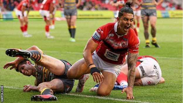 Salford Red Devils' Tim Lafai celebrates scoring a try