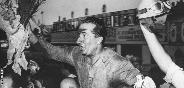 Alberto Ascari celebrates winning the 1951 Italian GP