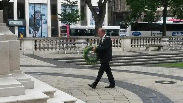 Lord Mayor of Belfast, Arder Carson, laying a wreath at the City Hall.