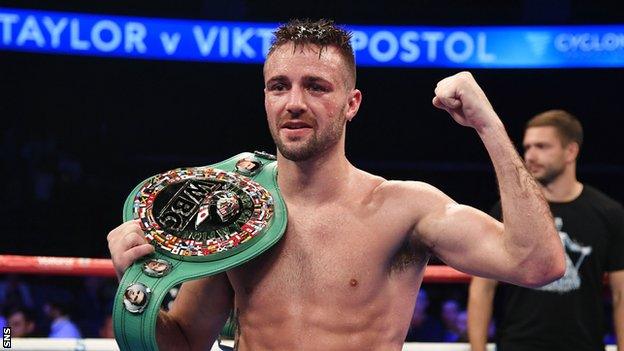 Josh Taylor celebrates his victory over Viktor Postol