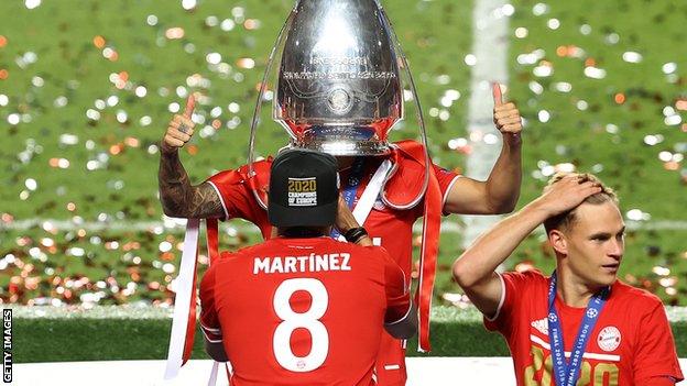 Lucas Hernandez of FC Bayern Munich celebrates with the Champions League trophy following his team's victory in the final