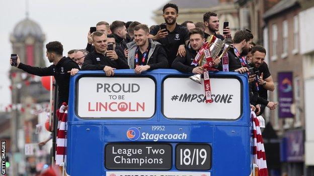 Lincoln City bus parade after winning the League Two title