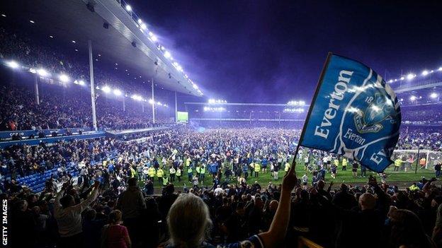 Everton fans ran onto the pitch when safety was confirmed