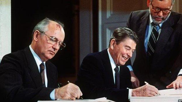 Mikhail Gorbachev and Ronald Reagan signing the INF treaty in 1987