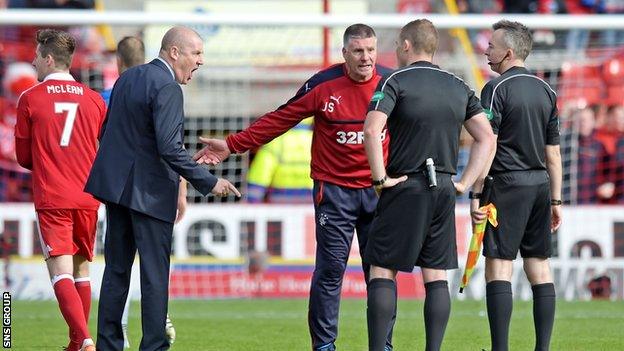 Rangers manager Mark Warburton exchanged words with the match officials on the pitch at full time