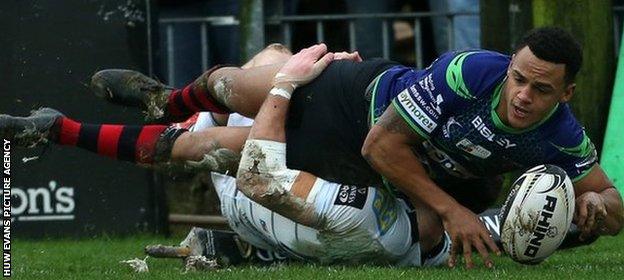 Dragons wing Ashton Hewitt dives over for the game's opening try