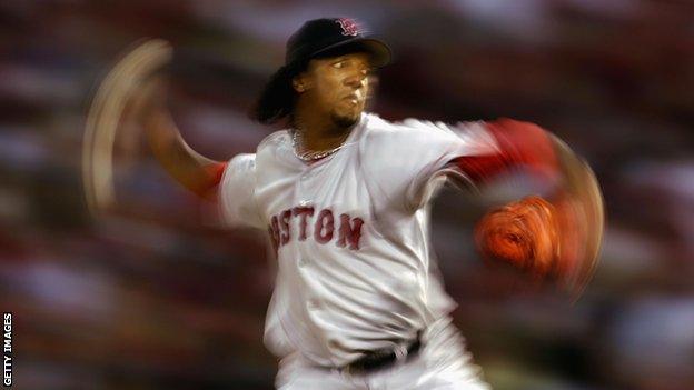 Starting pitcher Pedro Martinez #45 of the Boston Red Sox throws a pitch against the St. Louis Cardinals during the first inning of game three of the World Series on October 26, 2004