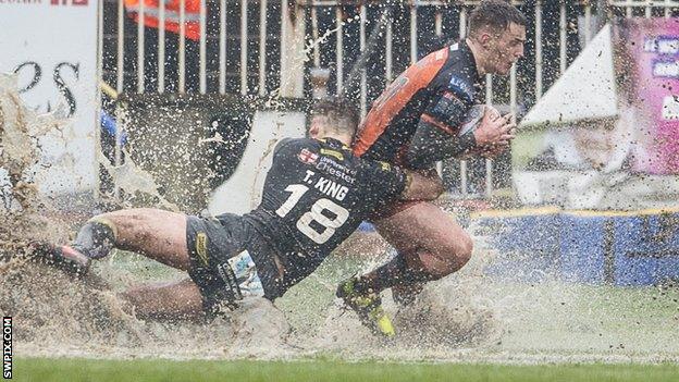 Castleford's Jake Trueman is tackled by Warrington's Toby King