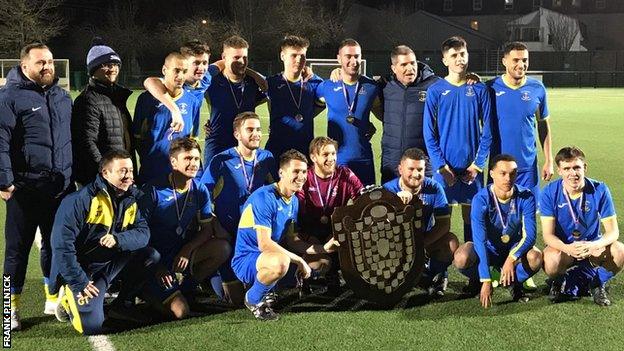 St Clement celebrate Trinity Shield win