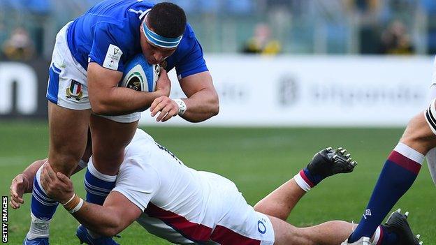 Danilo Fischetti is tackled by an England player while playing for Italy