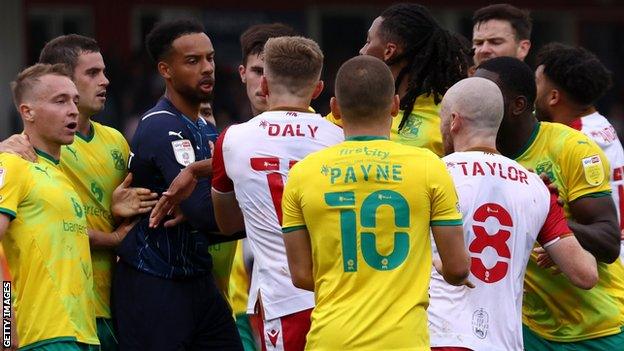 Stevenage and Swindon players clash