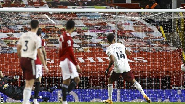 Pierre-Emerick Aubameyang (right) scores for Arsenal