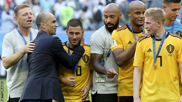 Roberto Martinez celebrates with Belgium staff and players after victory over England in the third place play-off at the 2018 World Cup