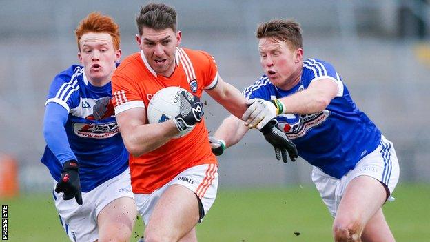 Armagh's Anthony Duffy in action against James Kelly and Kevin Meaney of Laois