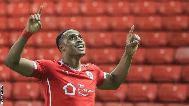 Victor Adeboyejo celebrates scoring for Barnsley