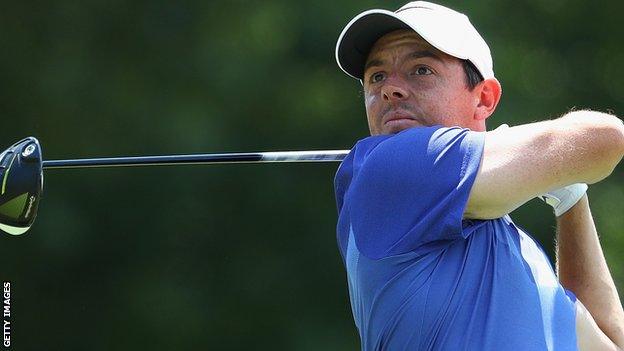 Rory McIlroy watches his drive on the 18th in Sunday's final round