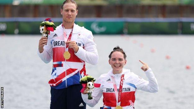 Laurence Whiteley and Lauren Rowles of Great Britain celebrate after winning the gold medal in the PR2 mixed double sculls final