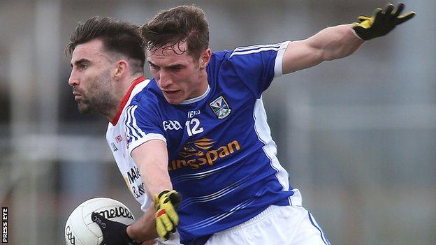 Cavan's Niall Clerkin challenges Tyrone's Tiernan McCann