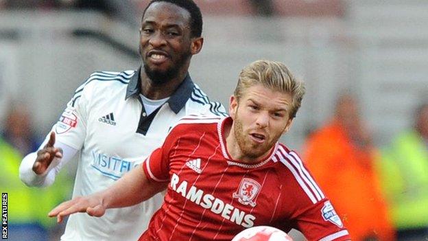 Adam Clayton and Moussa Dembele