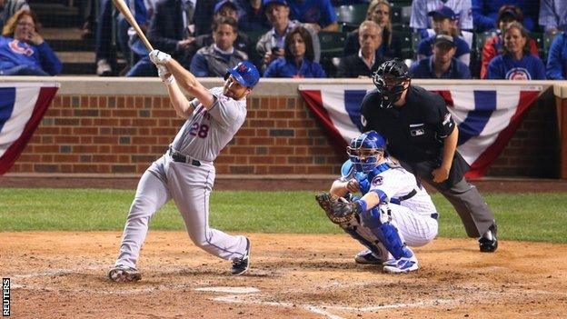 New York Mets second baseman Daniel Murphy hits a two-run home run against the Chicago Cubs