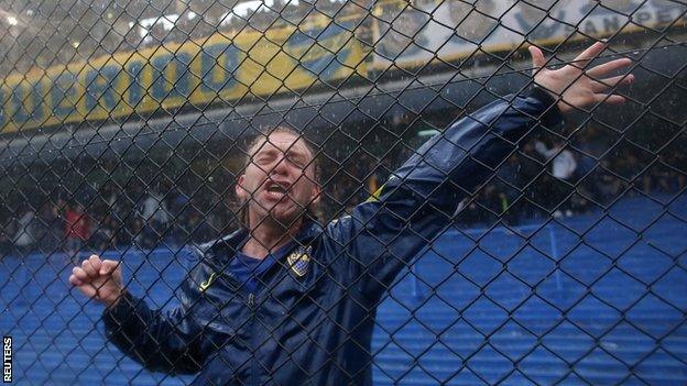 Boca Juniors fan in the rain