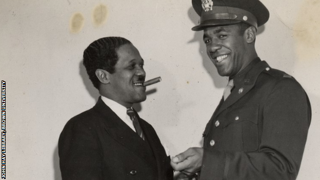 Pollard, with cigar, pictured in 1950 with his son Fritz Jr.