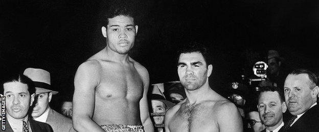 Joe Louis (centre left) and Max Schmeling (centre right) at the weigh-in before their world title in 1938