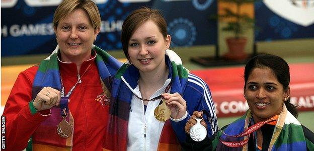 McIntosh (centre) claimed a gold medal at the 2010 Commonwealth Games, age 19