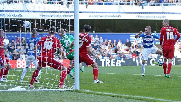 QPR defender Clint Hill heads his side into the lead against Cardiff