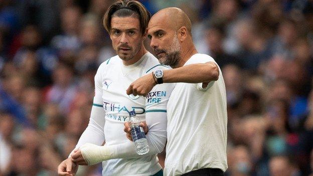 Jack Grealish and Pep Guardiola