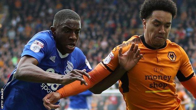 Birmingham's Wes Harding (left) tussles with Wolves winger Helder Costa