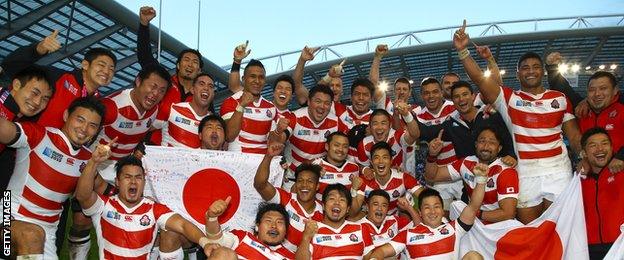 Japan's players celebrate their shock World Cup victory over South Africa in 2015